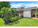 Well-maintained backyard with storage shed, partial fence, and brick exterior at 47 Oakwood Ct, Brownsburg, IN 46112