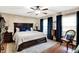 Bedroom featuring a wooden bedframe, plush rug, and natural light from the window at 47 Oakwood Ct, Brownsburg, IN 46112