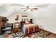 Bedroom featuring rustic stone accent wall, ceiling fan and room for a desk or seating area at 47 Oakwood Ct, Brownsburg, IN 46112