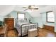 Comfortable bedroom featuring a bed with floral sheets, a chest, and a built-in bench at 47 Oakwood Ct, Brownsburg, IN 46112
