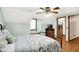 Comfortable bedroom with a ceiling fan, window seat and access to closet storage at 47 Oakwood Ct, Brownsburg, IN 46112