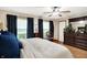 Bedroom with decorative furniture and dark wooden dresser providing cozy and relaxing appeal at 47 Oakwood Ct, Brownsburg, IN 46112