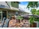 Wooden deck area featuring a built-in hot tub, patio seating, and privacy at 47 Oakwood Ct, Brownsburg, IN 46112