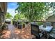 Spacious wooden deck area featuring multiple seating areas and shade trees at 47 Oakwood Ct, Brownsburg, IN 46112