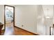 Hallway with hardwood floors and access to an adjacent bedroom at 47 Oakwood Ct, Brownsburg, IN 46112
