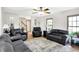 Comfortable living room with hardwood floors, neutral walls, and ample seating arrangements at 47 Oakwood Ct, Brownsburg, IN 46112