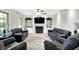 Spacious living room with custom built-ins, a fireplace, and comfortable seating arrangement at 47 Oakwood Ct, Brownsburg, IN 46112