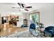 Open-concept living room with wood floors leading to a kitchen and dining area at 47 Oakwood Ct, Brownsburg, IN 46112