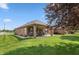 Spacious backyard featuring a patio, lush green lawn, and a well-maintained landscape at 5229 Imperial Dr, Columbus, IN 47203