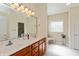 Bathroom with a double vanity, large mirror, and natural light, offering a functional space at 5229 Imperial Dr, Columbus, IN 47203