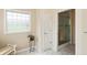 Bathroom with a decorative window and glass-enclosed shower, providing a functional design at 5229 Imperial Dr, Columbus, IN 47203