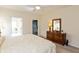 Bright bedroom featuring a bed, dresser with mirror, and closet, offering a comfortable space at 5229 Imperial Dr, Columbus, IN 47203