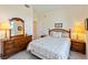 Inviting bedroom showcasing wood furniture and soft, neutral tones at 5229 Imperial Dr, Columbus, IN 47203