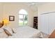 Comfortable bedroom featuring vaulted window and plush bedding at 5229 Imperial Dr, Columbus, IN 47203