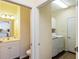 Hallway view showing a bathroom and laundry room, providing convenient access to amenities at 5229 Imperial Dr, Columbus, IN 47203