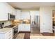 Bright kitchen with stainless steel appliances, granite countertops and white cabinetry at 5229 Imperial Dr, Columbus, IN 47203