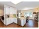 Well-lit kitchen with granite countertops and stainless steel dishwasher; open concept view of dining room at 5229 Imperial Dr, Columbus, IN 47203