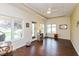 Cozy living room with wood floors, tray ceiling, and bright windows at 5229 Imperial Dr, Columbus, IN 47203