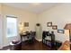 Bright office space with a desk, chair, filing cabinet, and natural light from a large window at 5229 Imperial Dr, Columbus, IN 47203