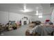 Unfinished basement with painted walls, fireplace, and some furniture creates potential for customization at 5435 E 10Th St, Indianapolis, IN 46219