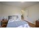 Bright bedroom with natural light, wood floors, and neutral wall color at 5435 E 10Th St, Indianapolis, IN 46219