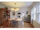 Open concept dining room featuring hardwood floors and seamless transition to living and kitchen areas at 5435 E 10Th St, Indianapolis, IN 46219