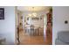 Bright dining room featuring hardwood floors and seamless access to kitchen and living spaces at 5435 E 10Th St, Indianapolis, IN 46219