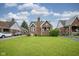 Beautiful brick home with a spacious front yard, mature trees, and a welcoming neighborhood feel at 5435 E 10Th St, Indianapolis, IN 46219