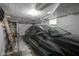 Spacious garage interior with a black car parked inside, offering secure vehicle storage at 5435 E 10Th St, Indianapolis, IN 46219