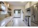 Bright kitchen features stainless steel appliances, tiled backsplash and eat-in area at 5435 E 10Th St, Indianapolis, IN 46219