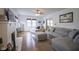 Comfortable living room with a fireplace, abundant natural light, and an open layout at 5435 E 10Th St, Indianapolis, IN 46219