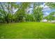 Expansive grassy backyard with mature trees at 5516 W Minnesota St, Indianapolis, IN 46241