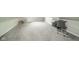 Spacious basement with ample room for storage or recreation, featuring neutral carpet at 5516 W Minnesota St, Indianapolis, IN 46241