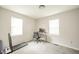 Bright bedroom with two windows, a desk, and a treadmill, perfect for a home office at 5516 W Minnesota St, Indianapolis, IN 46241