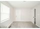 Neutral bedroom features natural light, carpet, and offers great flex space at 5516 W Minnesota St, Indianapolis, IN 46241