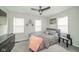 Cozy bedroom featuring a ceiling fan, neutral decor, and comfortable carpeting at 5516 W Minnesota St, Indianapolis, IN 46241
