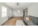 Open-concept living space with hardwood floors and modern decor, perfect for entertaining at 5516 W Minnesota St, Indianapolis, IN 46241