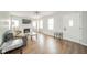 Bright and spacious living room with hardwood floors, neutral walls, and modern lighting at 5516 W Minnesota St, Indianapolis, IN 46241