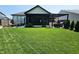 Spacious backyard features a covered patio, pergola, and well-maintained lawn at 5686 Ellie Ct, Noblesville, IN 46062