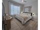 Well-lit bedroom with stylish furnishings and a decorative mirror collage at 5686 Ellie Ct, Noblesville, IN 46062