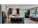 Bright kitchen features an oversized island with seating and stainless steel appliances at 5686 Ellie Ct, Noblesville, IN 46062
