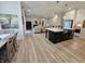 Open-concept living area flows to the kitchen, creating an inviting space to relax at 5686 Ellie Ct, Noblesville, IN 46062