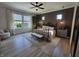 Bedroom featuring a large window, paneled wall, and modern ceiling fan at 5686 Ellie Ct, Noblesville, IN 46062