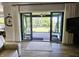 View of a screened-in patio with neutral furniture, accessed from the living area at 5686 Ellie Ct, Noblesville, IN 46062