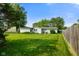 Spacious backyard featuring well-maintained lawn and the home's exterior at 623 Circle Ct, Whiteland, IN 46184