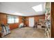Unfinished basement featuring paneled walls, shelving, and a functional layout at 623 Circle Ct, Whiteland, IN 46184