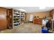 Unfinished basement offers ample storage with shelving and room for customization at 623 Circle Ct, Whiteland, IN 46184