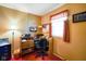 Functional bedroom with desk area, natural light, and warm-toned walls at 623 Circle Ct, Whiteland, IN 46184