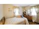Bedroom with a comfortable bed, dresser, and floral curtains at 623 Circle Ct, Whiteland, IN 46184