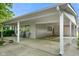 Spacious carport area providing covered parking and easy access to the home's entrance at 623 Circle Ct, Whiteland, IN 46184